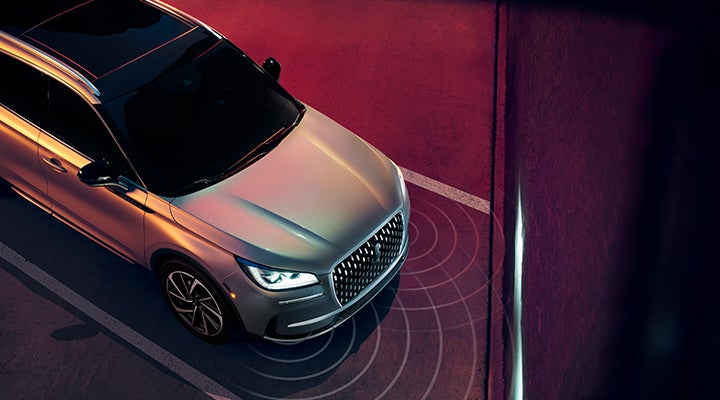 Illustrated radar signals are shown emitting from the front of a 2024 Lincoln Corsair® SUV. | Covert Lincoln Austin in Austin TX