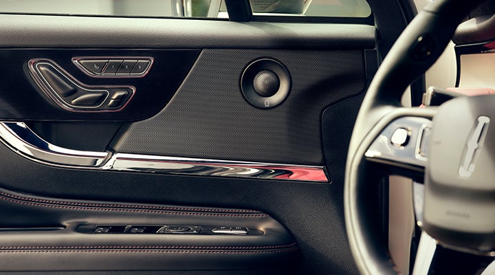 A Revel® audio speaker is shown in the driver’s side door of a 2024 Lincoln Corsair® SUV. | Covert Lincoln Austin in Austin TX