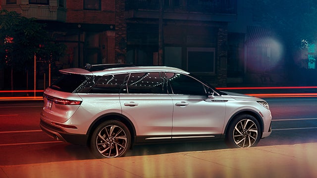 The 2024 Lincoln Corsair® SUV is parked on a city street at night. | Covert Lincoln Austin in Austin TX