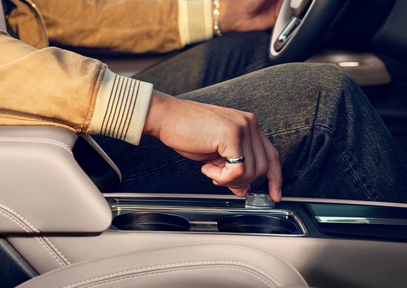 The driver of a 2024 Lincoln Corsair® SUV is shown selecting the drive mode. | Covert Lincoln Austin in Austin TX