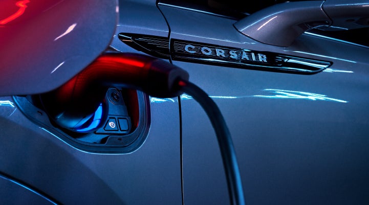 A charger plugged into the charging port of a 2024 Lincoln Corsair® Plug-in Hybrid model. | Covert Lincoln Austin in Austin TX