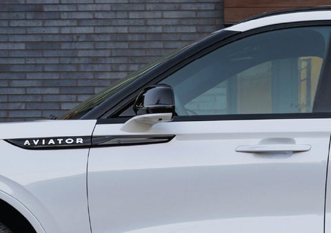 The driver’s side door and fender badging of a white 2026 Lincoln Aviator® SUV are showcased. | Covert Lincoln Austin in Austin TX