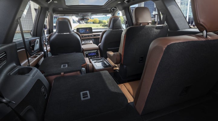 One side of the PowerFold® third-row seat and a second-row seat are folded forward in the 2026 Lincoln Aviator® SUV. | Covert Lincoln Austin in Austin TX