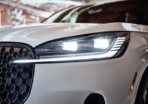 A close-up of a headlamp on the 2027 Lincoln Aviator® SUV is shown. | Covert Lincoln Austin in Austin TX