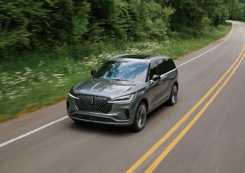 A 2027 Lincoln Aviator® SUV is being driven down a road. | Covert Lincoln Austin in Austin TX