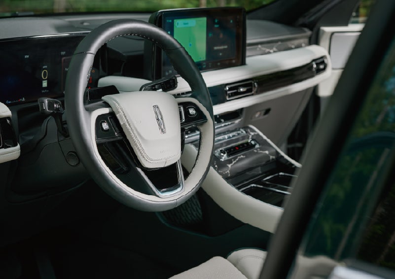 The leather-trimmed steering wheel of a 2027 Lincoln Aviator® Black Label™ SUV. | Covert Lincoln Austin in Austin TX