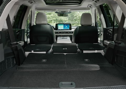 A rear to front view of the interior of a 2027 Lincoln Aviator® Black Label™ SUV shows the third and second rows folded flat | Covert Lincoln Austin in Austin TX