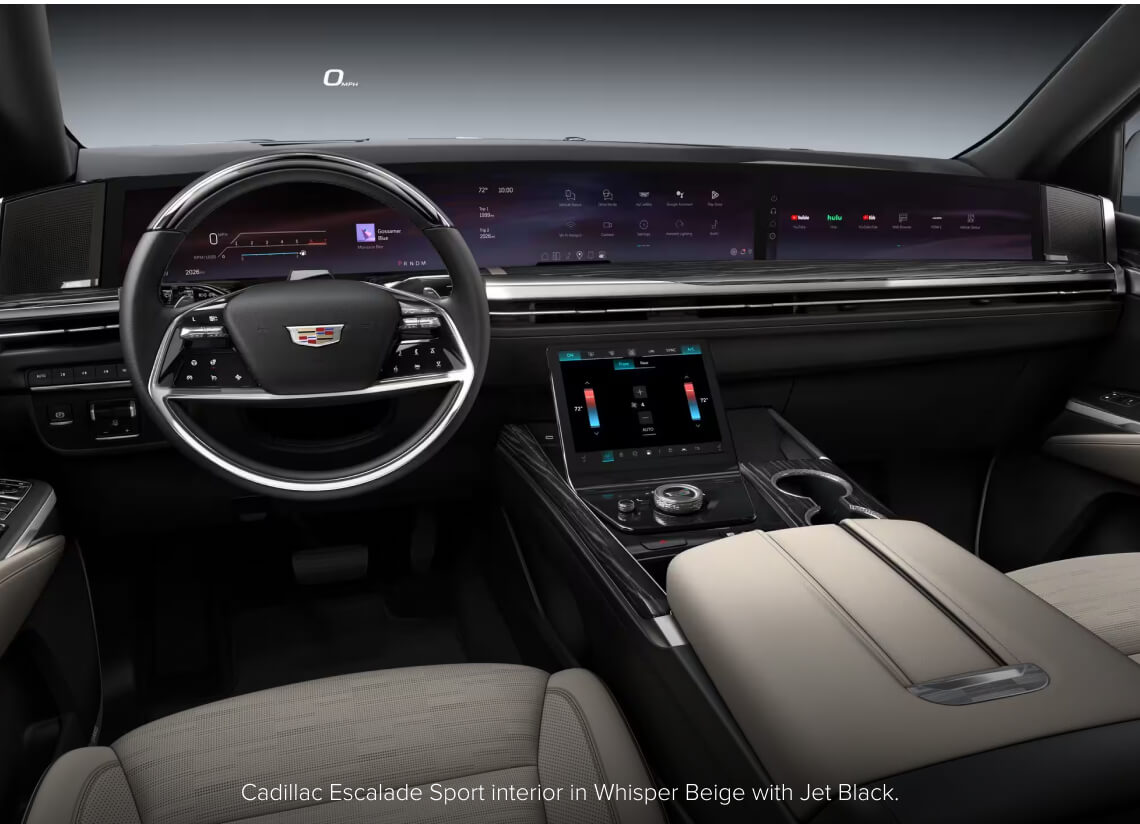 Interior dashboard view of a Cadillac Escalade Sport in Whisper Beige and Jet Black highlighting its display.