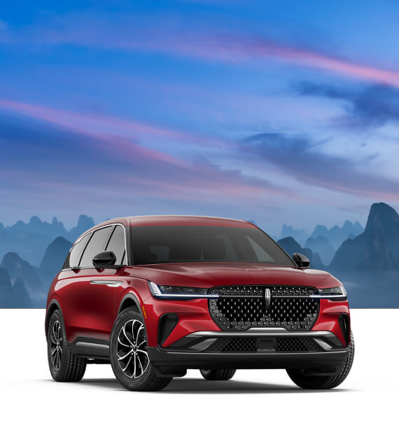 Front three-quarter view of a red Lincoln Nautilus Premiere with a mountain sunset backdrop overlay.